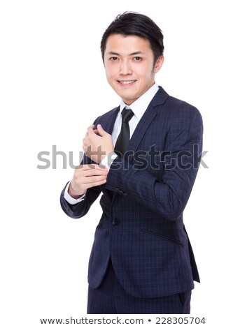 ストックフォト: Portrait Of Happy Young Businessman Fixing His Suit Sleeves