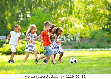 Stock foto: Many Kids Playing In The Park