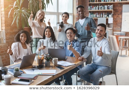 Stock foto: Happy Creative Team Showing Thumbs Up At Office