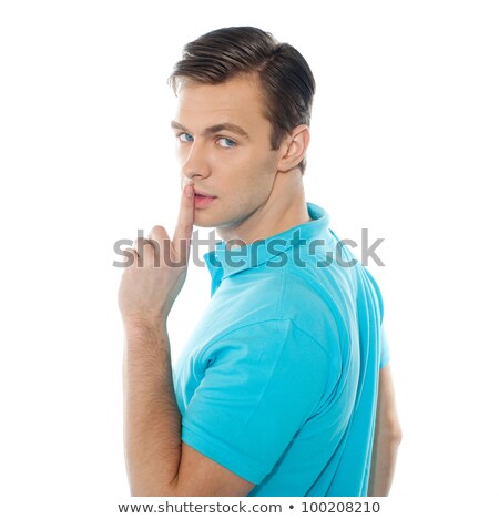 Side View Of Smart Handsome Guy Gesturing Silence Foto stock © stockyimages