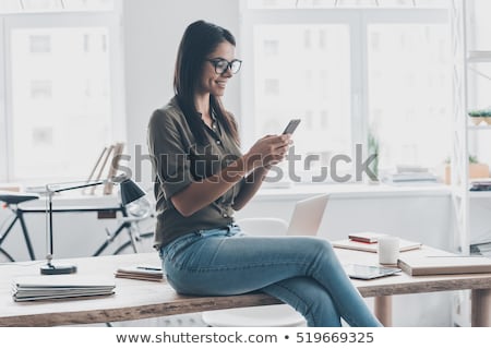 Zdjęcia stock: Young Business Woman Text Messaging At Office Desk