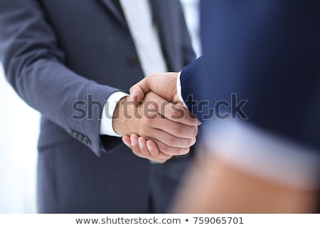 Foto stock: Negotiating Business Two Confident Business Man Shaking Hands W