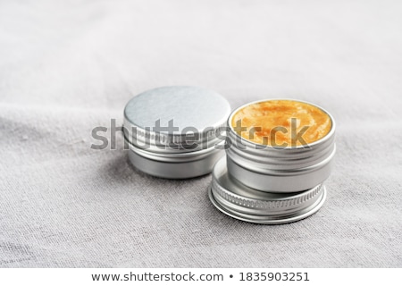 Foto stock: Lip Balm In Metallic Tins