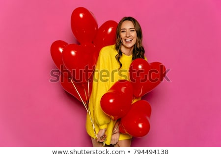 Foto d'archivio: Gorgeous Woman Holding Red Heart