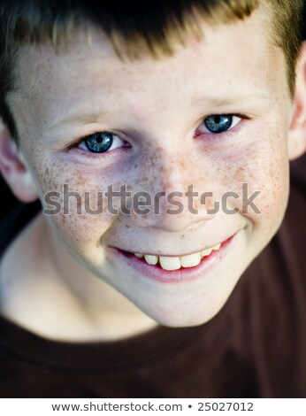 Stock foto: Vertical Portrait Of Innocent Little Child With Blue Eyeys And Plump Cheeks Looks Directly Into Cam