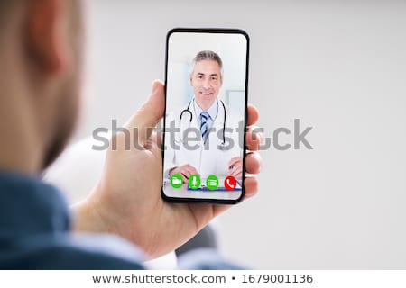 [[stock_photo]]: Doctor With Mobile Phone