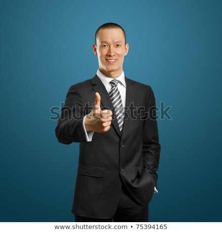 Asian Businessman In Black Suit Shows Well Done Stock foto © leedsn