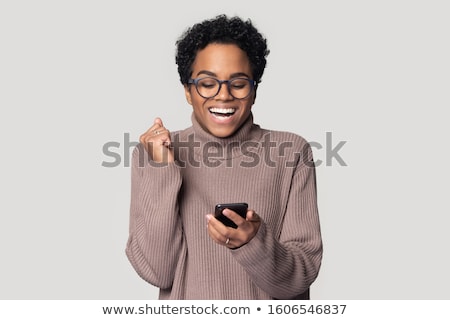 Foto stock: Success And Approval Concept Positive Female With Black Long Hair Has Pleasant Smile Keeps Thumbs