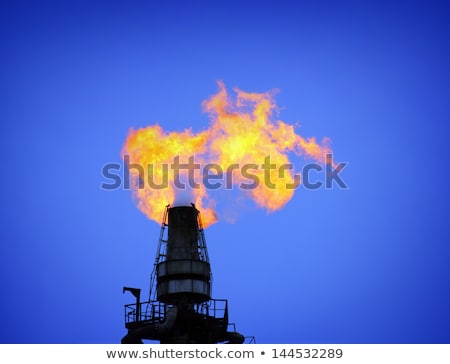 Foto stock: Torch Is Lit On Tower Refinery