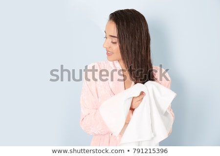 Stockfoto: Young Woman Drying Her Hair On White Background