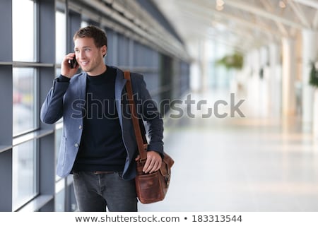 Young Handsome Businessman Talking At The Cell Phone Stock foto © Maridav