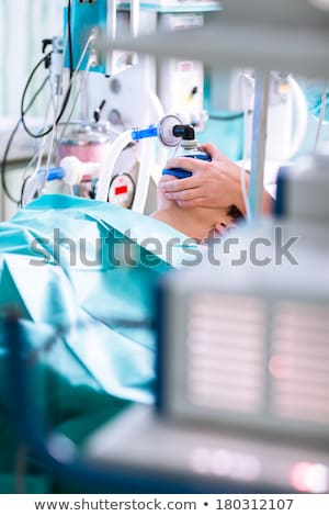 [[stock_photo]]: Anesthesia - Patient Under Narcosis Breathing Through A Mask Du