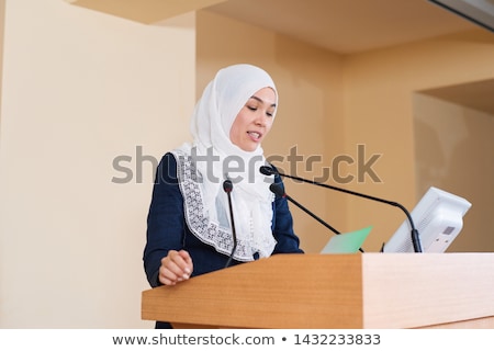 Asian Businesswoman Speech On Tribune Stockfoto © Pressmaster