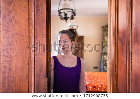 Сток-фото: Woman Standing In Wooden Doorway