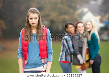 [[stock_photo]]: Dolescente · bouleversée · avec · des · amis · potins · en · arrière-plan