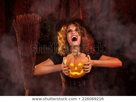 A Young Woman Dressed As A Witch Zdjęcia stock © MilanMarkovic78