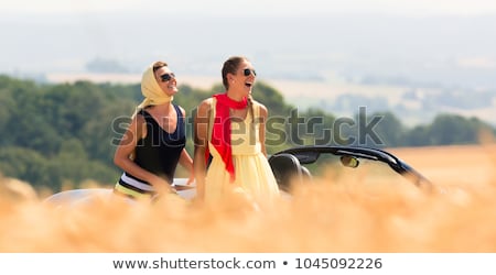 Happy Caucasian Woman In A Cabriolet Stockfoto © Kzenon