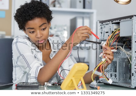 Stockfoto: Woman Repairing The Computer