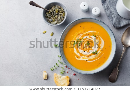 Foto stock: Pumpkin And Carrot Soup With Seeds Top View