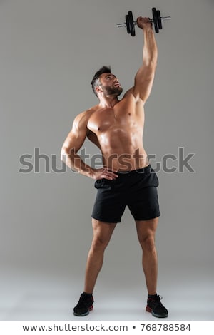 Zdjęcia stock: Shirtless Man Lifting Heavy Dumbbell