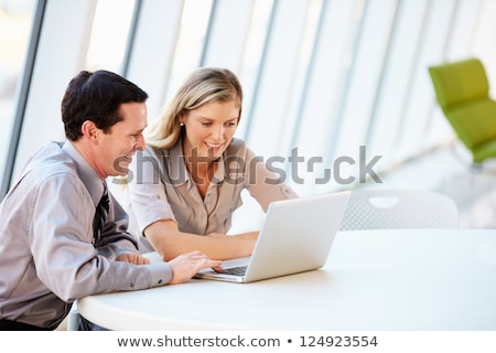 [[stock_photo]]: Businessman With Laptop At Office Glass Board