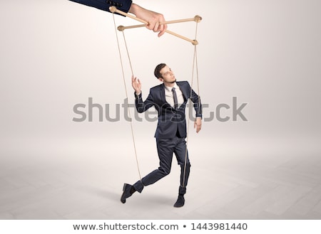 Stock fotó: Puppet Businessman Leaded By A Huge Hand