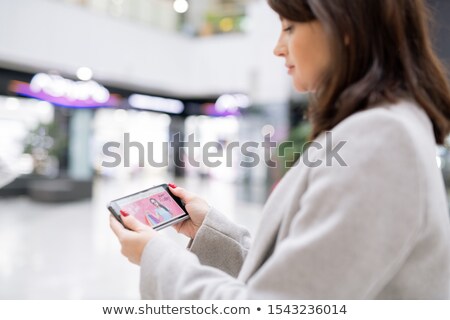 Foto d'archivio: Young Woman Looking At Home Page Of Online Shop While Going To Make Order