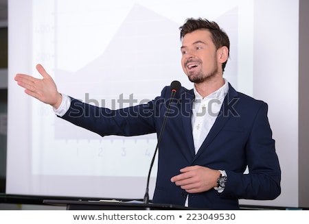 ストックフォト: Handsome Young Man Giving A Speech At A Conference