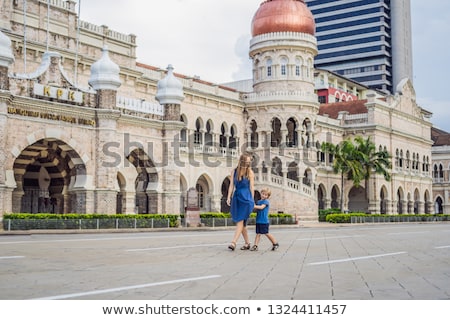 Foto stock: Mom And Son On Background Of Sultan Abdul Samad Building In Kuala Lumpur Malaysia Traveling With C