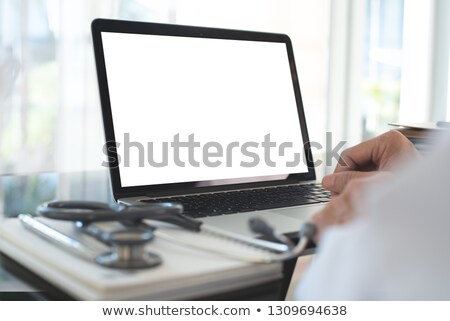 Imagine de stoc: Doctor With Blank Laptop Screen