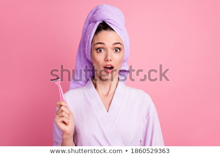 Foto stock: Surprised Young Woman In Bathroom