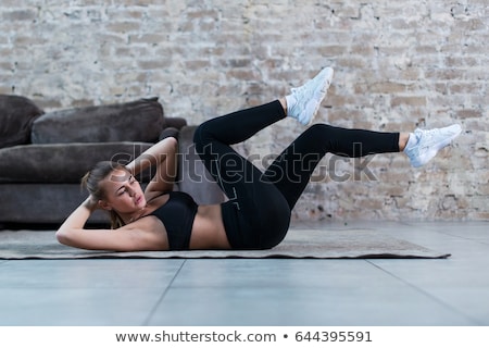 Stok fotoğraf: Young Woman Doing Abdominal Exercises