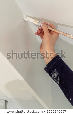 [[stock_photo]]: Painter Painting A Ceiling Corner