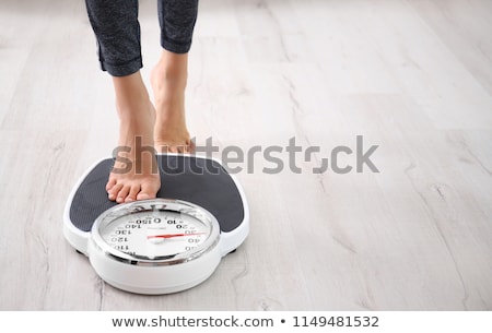 ストックフォト: Woman Using Floor Scales