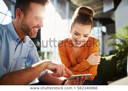 Stock photo: Smiling Attractive Businessman Sitting With Smartphone In Restaurant