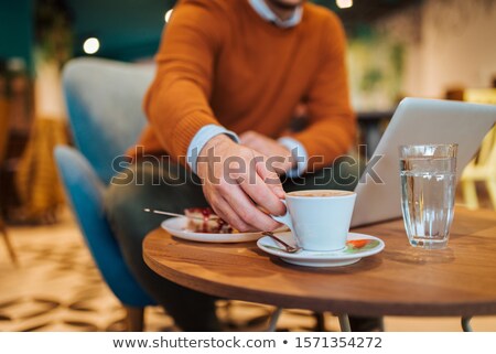 [[stock_photo]]: Handsome Businessman Work At The Laptop In Restaurant Close Up