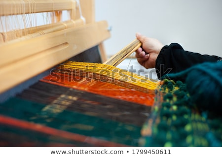 Stock photo: Peruvian Indian Woman In Traditional Dress Weaving