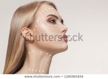 Stock photo: Beautiful Girl With Facial Arrows On Her Skin