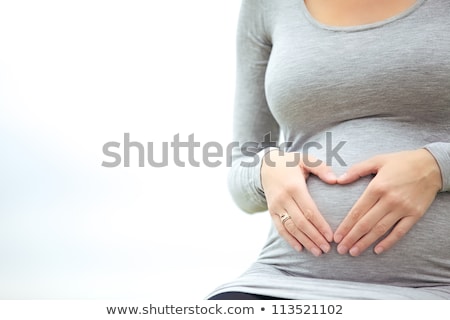 Stok fotoğraf: Expectant Mother Bonding With Her Unborn Child