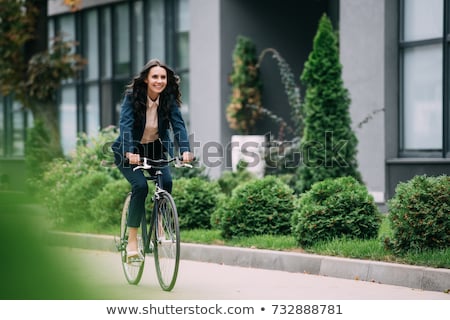 ストックフォト: Woman Cycling To Work