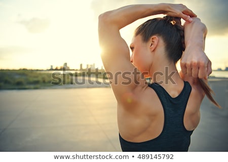 Stock fotó: Biceps Arm Stretching Exercise By A Woman
