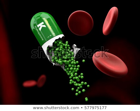 Сток-фото: Illustration Of Vitamin K Capsule Dissolves In The Stomach