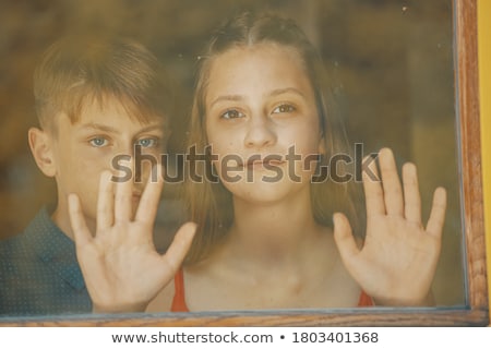 Stok fotoğraf: Portrait Of Happy Couple In Cafe Behind The Glass