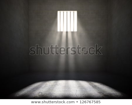 Foto stock: Sunshine Shining In Prison Cell Window