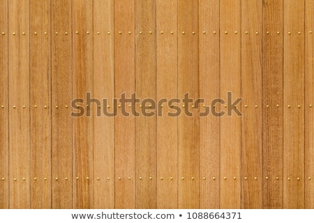 Stock photo: Teak Wood Panel With Brass Nail