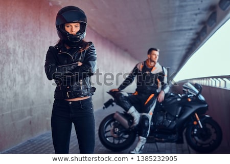 [[stock_photo]]: Biker Girl Sitting On Motorcycle