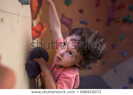 ストックフォト: Man Climber On Artificial Climbing Wall In Bouldering Gym