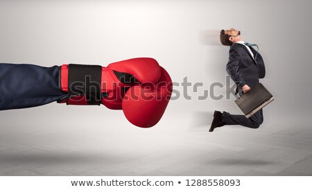 Stockfoto: Big Boss Kicking Little Employee