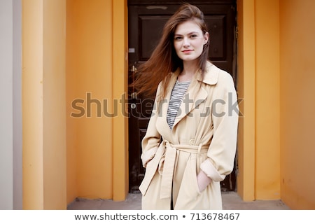 Stock photo: Beautiful Young Fashion Model Wearing A Trench Coat