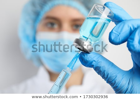 Stock photo: Doctor Filling Vaccine Syringe